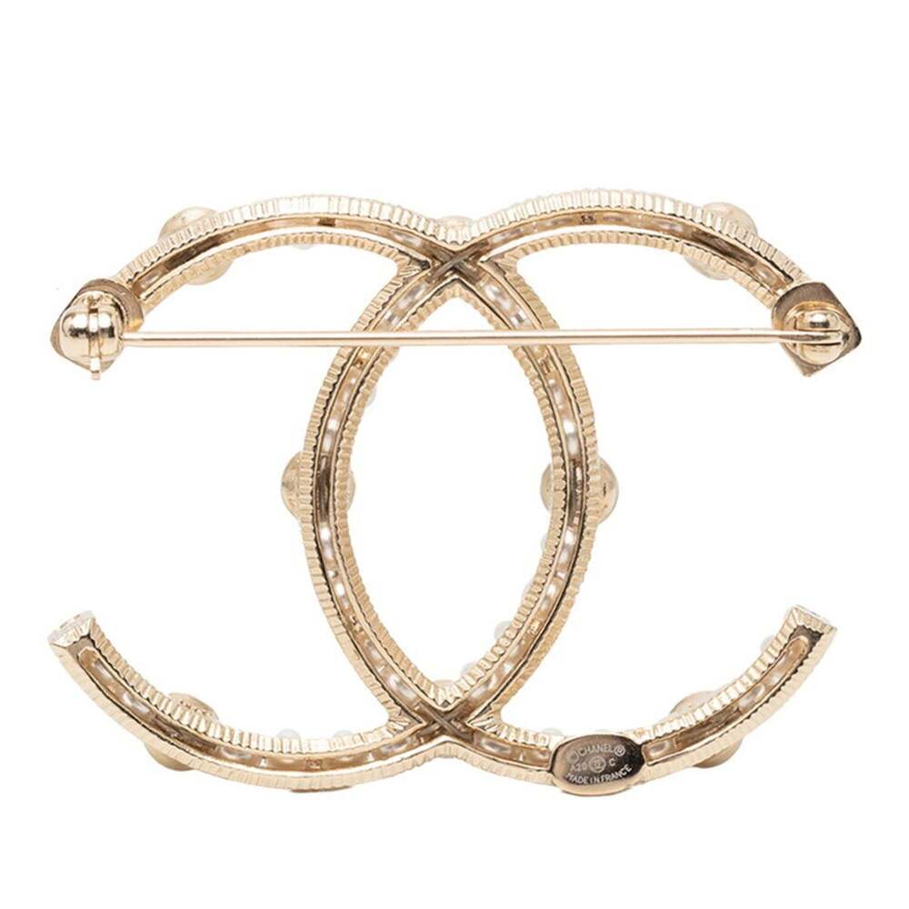 CHANEL Gold Pearl Logo Brooch - Picture 2 of 4
